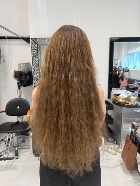 The finished result: long, full, wavy honey-brown hair
